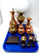 A tray containing assorted metalware including a brass oil lamp with chimney and opaque shade,