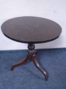 A 19th century oak pedestal occasional table.