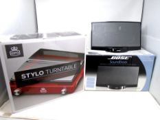 A Bose sound docking station together with a reproduction GPO Stylo turntable.