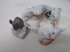 A Royal Copenhagen figure of a polar bear together with two further Royal Copenhagen figures of