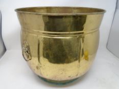 A large brass planter.