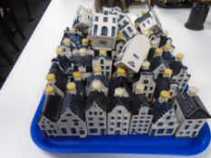 A quantity of KLM by Bols blue Delft houses.