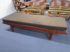 A mid-20th century day bed with interior.