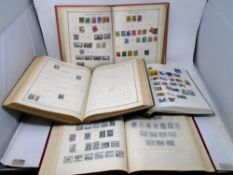 A box containing four postage stamp albums.