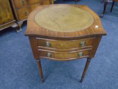 A mahogany Regency style occasional table with leather inset top