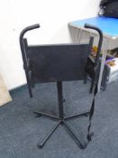 A metal adjustable music stand.