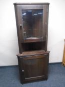 A stained pine corner display cabinet.