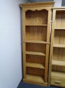 A pine open bookcase.