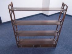 A mahogany wall shelf fitted with two drawers