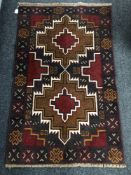 A Baluchi rug 136 cm x 86 cm