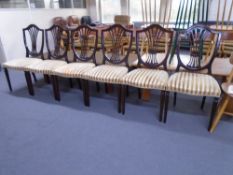 A set of six mahogany shield back chairs.