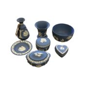 Seven pieces of Wedgwood Jasperware (blue and white) china cabinet pieces.