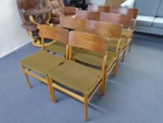 A set of eight mid-20th century teak and plywood dining chairs.