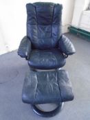 A Stressless black leather adjustable swivel armchair with footstool.