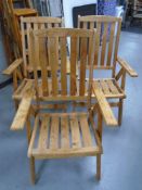 Three pine high backed folding garden chairs.
