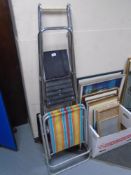 Two sets of 20th century folding metal steps together with a further folding deck chair.