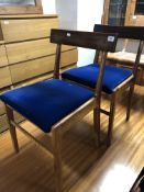 A pair of mid-20th century teak dining chairs