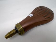 A copper and brass powder flask.