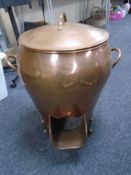 A large copper lidded coal receiver.