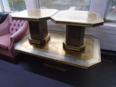A Danish brass octagonal pedestal coffee table together with a pair of matching lamp tables.