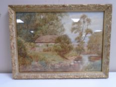 John Wilson Hepple : A thatched cottage by a river, watercolour, 37cm by 26cm.