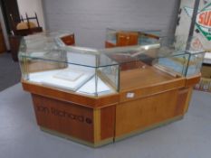 A seven piece jeweller's shop display counter fitted with cupboards and drawers beneath.