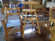A pine rush seated child's armchair together with a further child's armchair and a high chair.