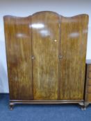 An Edwardian mahogany triple-door wardrobe