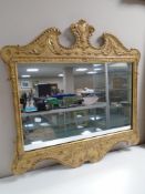 A 20th century gilt framed mirror, 66cm by 66cm.