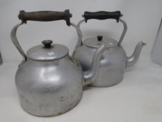 Two stainless steel kettles.