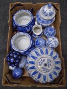 A box containing a blue and white Jardiniere, ceramic vase with cover, ceramic balls.
