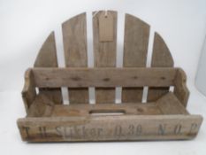 An antique wooden trough with advertising panel (width 43cm).