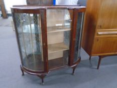 A 1930s walnut Art Deco display cabinet.