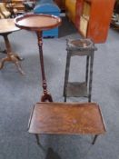 A carved Edwardian two tier plant stand together with a pedestal wine table and a folding bed tray