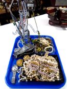 A tray of costume jewellery, necklaces etc.