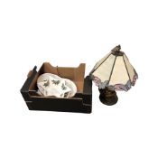 An ornate table lamp with Tiffany-style shade, together with three pieces of Portmerion china.