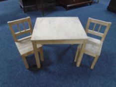 An Ikea child's table with two chairs