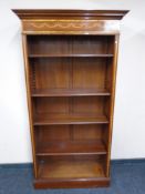 An inlaid mahogany open bookcase