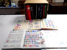 A box containing a quantity of stamp albums.