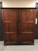 A Victorian pitch pine school cupboard (162cm by 183cm).