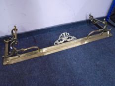 A 19th century brass extending fire curb.
