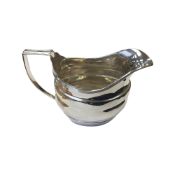 A silver milk jug, Chester 1929, height 9cm.