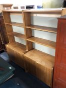 A pair of 20th century open bookshelves in teak finish