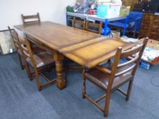 A good quality contemporary oak pull out dining table together with a set of six carved dining