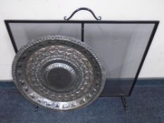 A metal spark guard together with a copper plaque