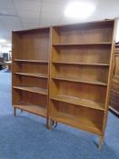 A pair of mid century teak-veneered open bookshelves
