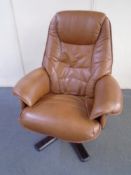 A brown leather adjustable swivel armchair.