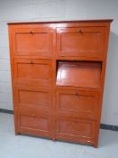 A 20th century painted pine eight door cabinet