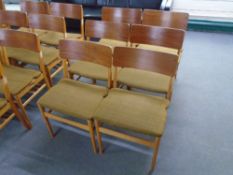 A set of six mid-20th century teak and plywood dining chairs.