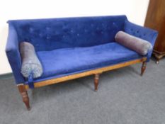 A 19th century settee in blue buttoned fabric
